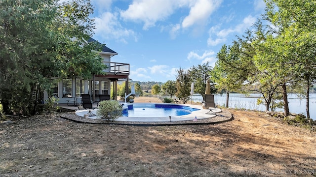 view of swimming pool featuring a water slide and a patio area