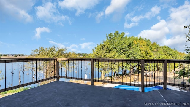 balcony featuring a water view