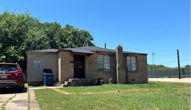 view of front of home with a front lawn