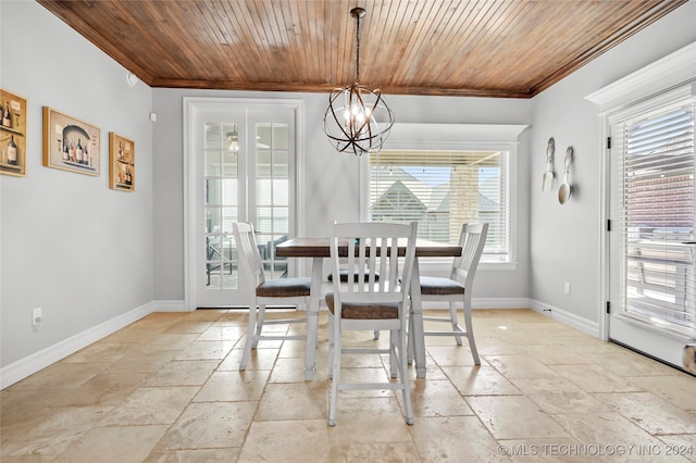 dining space with crown molding, a notable chandelier, and wooden ceiling