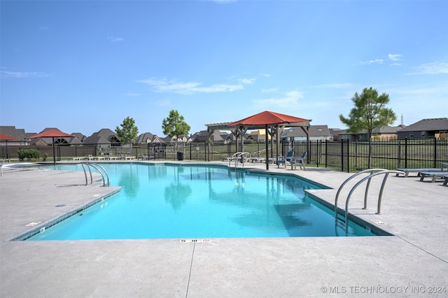 view of swimming pool featuring a gazebo