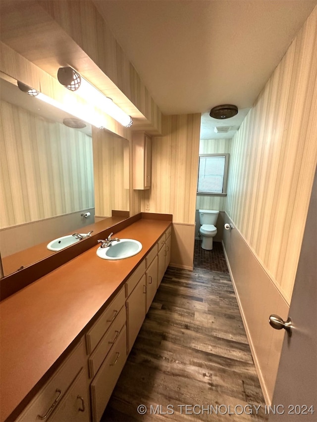 bathroom featuring hardwood / wood-style flooring and vanity