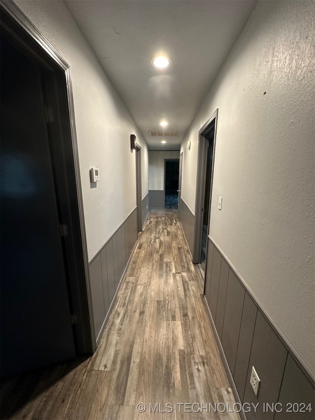 hallway with light wood-type flooring