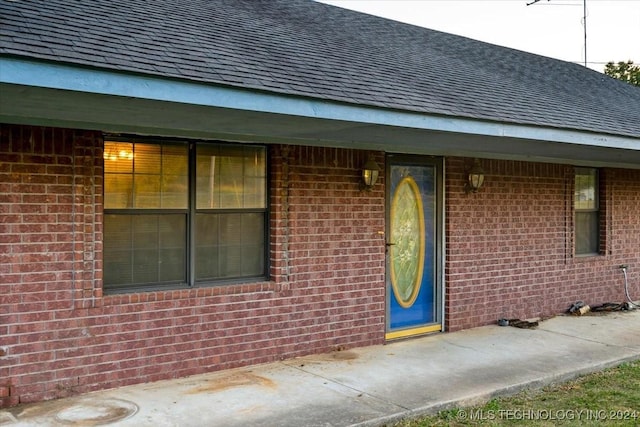 711 E Iowa, Whitefield, OK 74472 - view of exterior entry featuring brick siding and a shingled roof