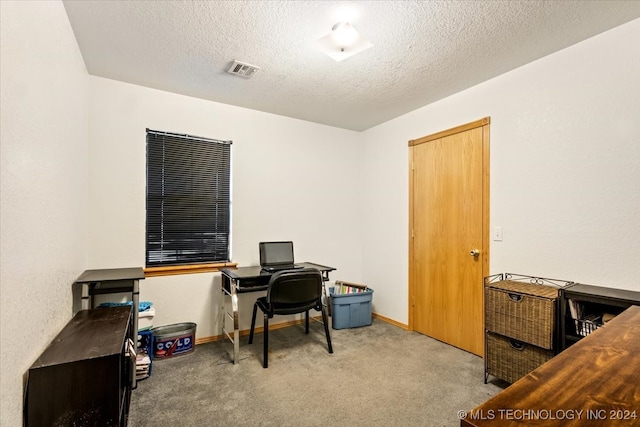 office area with carpet and a textured ceiling