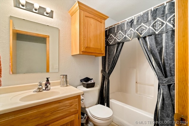 full bathroom with vanity, toilet, and shower / bath combo with shower curtain