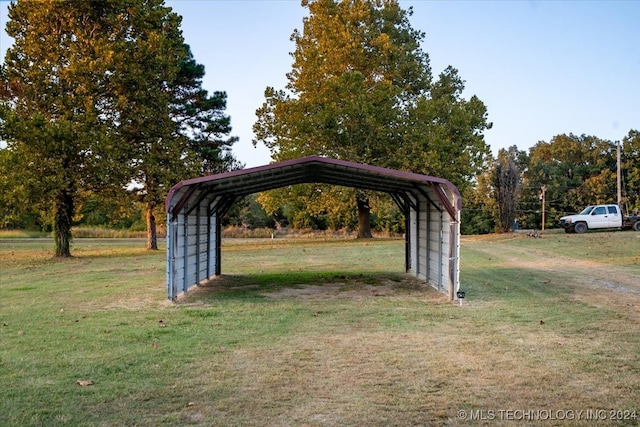 view of parking featuring a yard and a carport