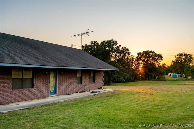 711 E Iowa, Whitefield, OK 74472 - exterior space featuring brick siding, a shingled roof, and a front lawn
