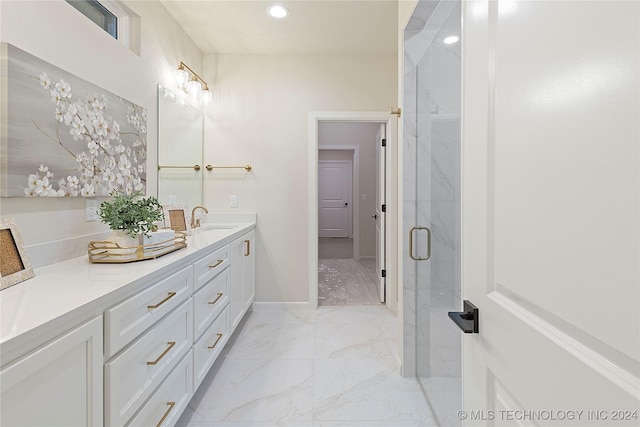 bathroom featuring recessed lighting, vanity, baseboards, marble finish floor, and a marble finish shower