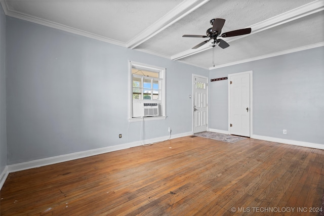 spare room with cooling unit, wood-type flooring, ceiling fan, and a textured ceiling