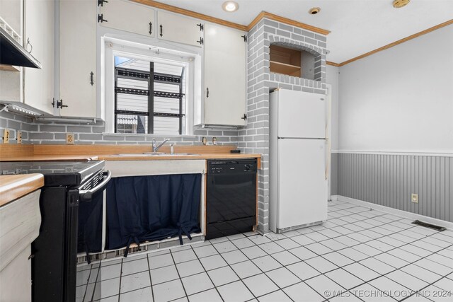 kitchen featuring white cabinetry, black appliances, sink, and backsplash