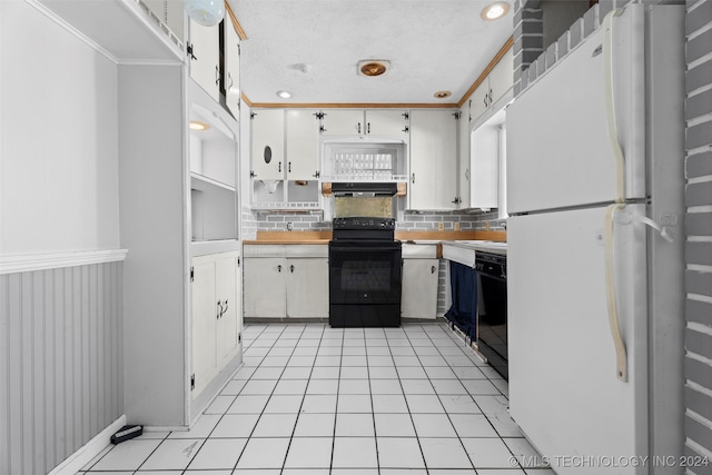 kitchen with black appliances, tasteful backsplash, ornamental molding, and white cabinets