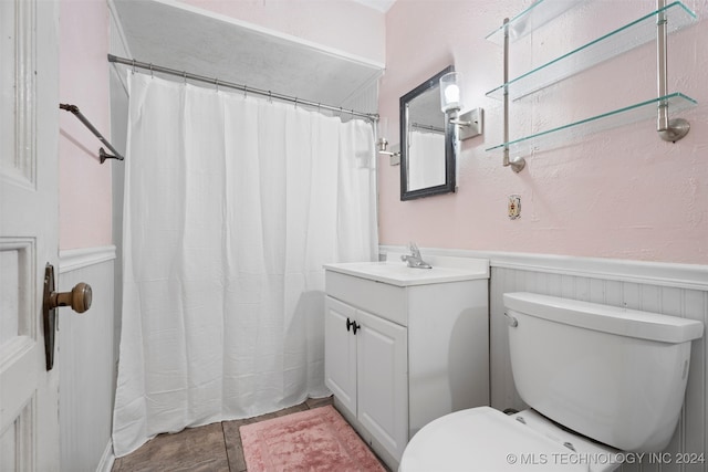 bathroom with toilet and vanity