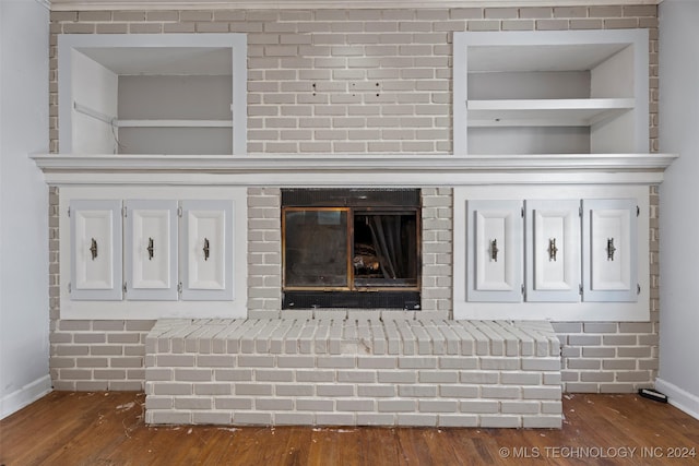 room details featuring hardwood / wood-style floors and a fireplace