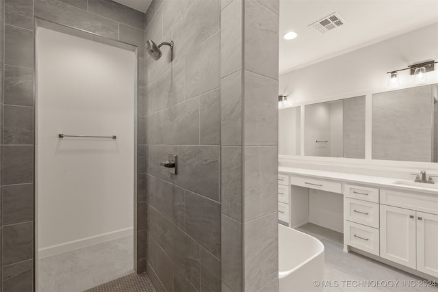 bathroom with a soaking tub, visible vents, vanity, tile patterned flooring, and tiled shower