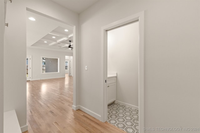 hall with beam ceiling, recessed lighting, light wood-style floors, coffered ceiling, and baseboards