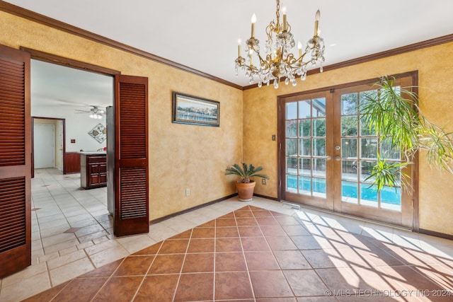 doorway to outside featuring french doors, ornamental molding, and ceiling fan with notable chandelier