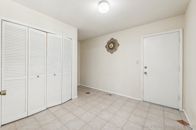 unfurnished bedroom with a closet