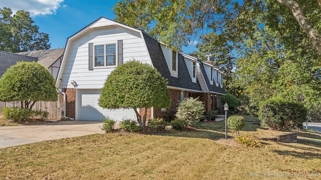 view of front of property with a front lawn and a garage