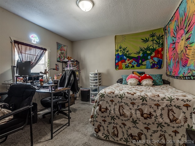 carpeted bedroom featuring a textured ceiling