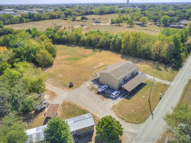 birds eye view of property with a rural view