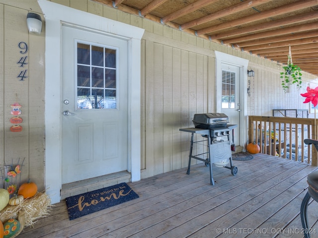 doorway to property featuring a deck