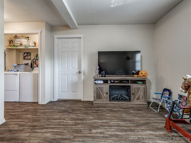 living room with dark hardwood / wood-style floors and washing machine and clothes dryer