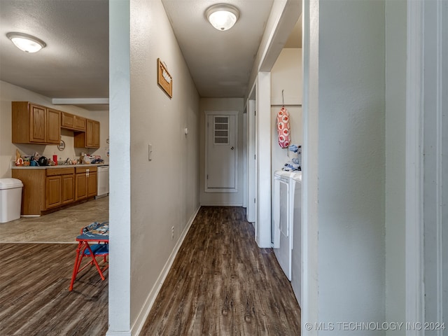 hall featuring separate washer and dryer and dark hardwood / wood-style floors