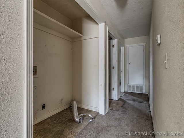 clothes washing area with washer hookup, hookup for an electric dryer, dark colored carpet, and a textured ceiling