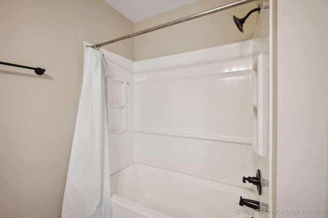 bathroom featuring shower / bath combination with curtain