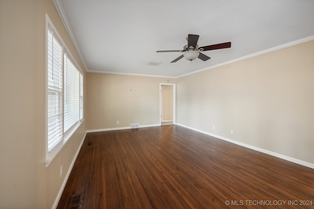 unfurnished room with ceiling fan, crown molding, and dark wood-type flooring