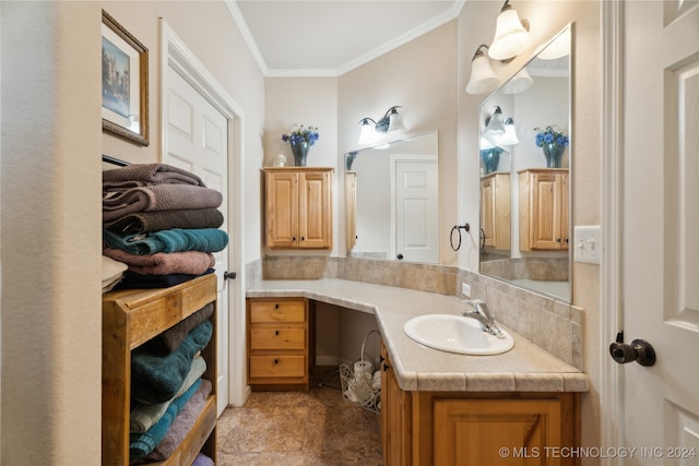 bathroom featuring vanity and ornamental molding