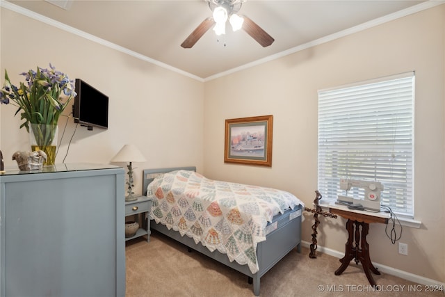 bedroom featuring light carpet, ceiling fan, and crown molding