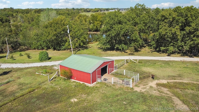 birds eye view of property with a rural view