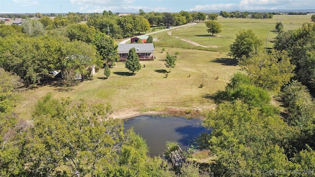 aerial view with a rural view and a water view