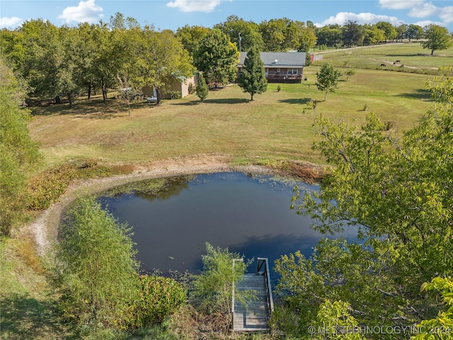 drone / aerial view featuring a water view and a rural view