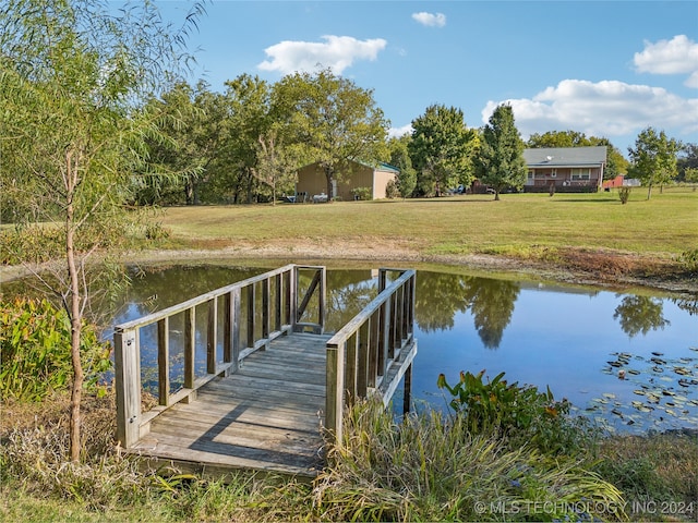 dock area with a water view