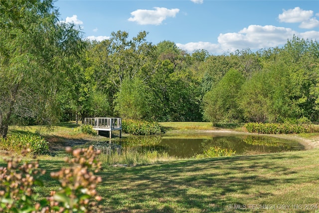 surrounding community with a water view