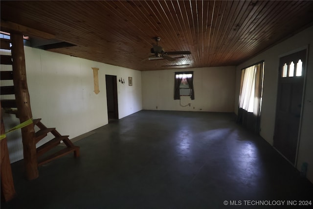 empty room with ceiling fan and wooden ceiling