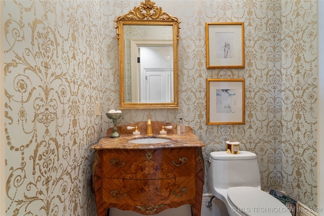 bathroom with vanity and toilet