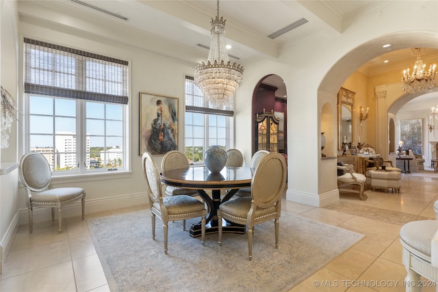 dining room with ornamental molding, light tile patterned flooring, and a healthy amount of sunlight