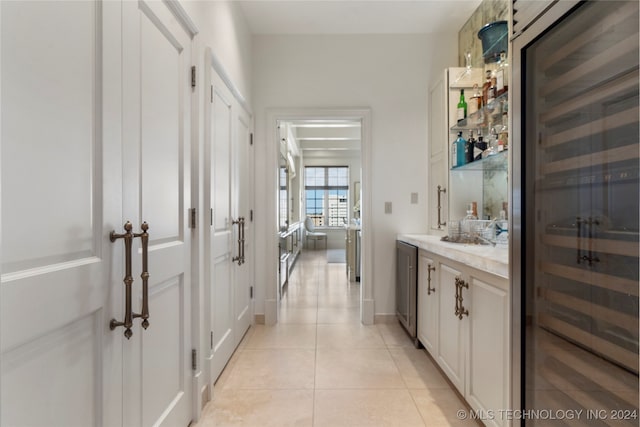 bathroom with vanity, beverage cooler, and tile patterned floors