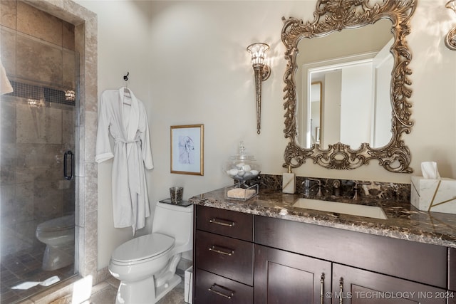 bathroom with vanity, toilet, and walk in shower