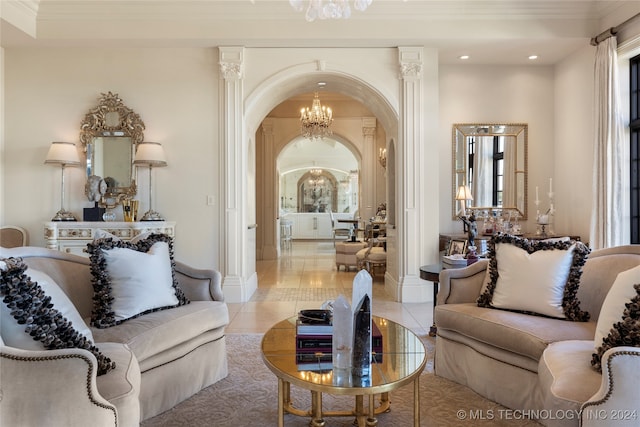 living room with ornamental molding, decorative columns, and light tile patterned floors