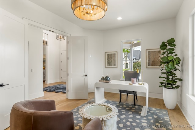 office featuring a chandelier and hardwood / wood-style floors