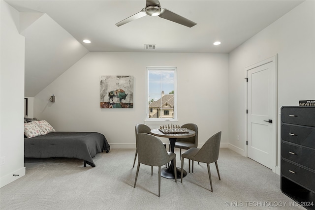 carpeted bedroom featuring vaulted ceiling and ceiling fan