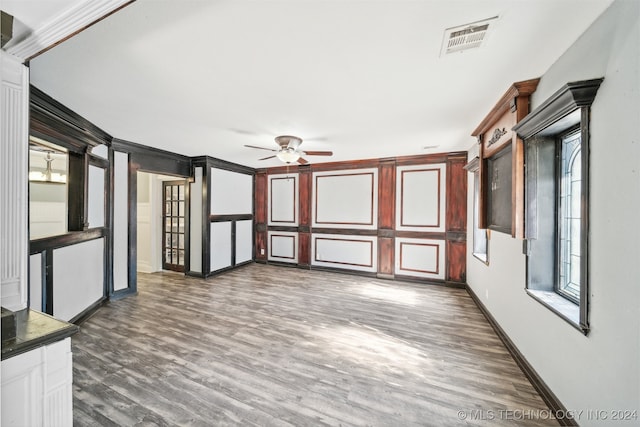 spare room featuring ceiling fan and dark wood-type flooring