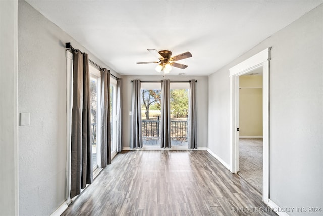 spare room with ceiling fan and light hardwood / wood-style floors