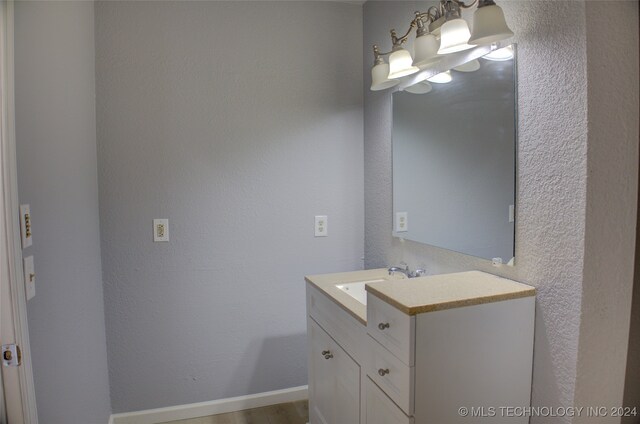 bathroom featuring hardwood / wood-style floors and vanity