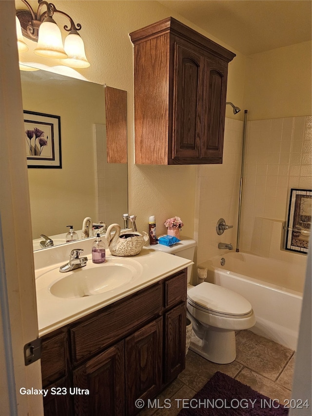 full bathroom featuring vanity, toilet, and tiled shower / bath combo